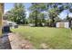 Large backyard featuring a shed and mature landscaping at 3428 Plaza Ln, North Charleston, SC 29420