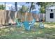 Landscaped backyard with inviting Adirondack chairs and fire pit at 3428 Plaza Ln, North Charleston, SC 29420