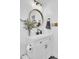 Stylish bathroom featuring a modern vanity, round mirror, and elegant decor at 3428 Plaza Ln, North Charleston, SC 29420