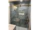 Bathroom showcasing a glass shower door, designer tile work, and a built-in shower caddy at 3428 Plaza Ln, North Charleston, SC 29420