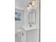 Chic bathroom boasts a modern vanity with gold accents, a stylish mirror, and attractive wall tiles at 3428 Plaza Ln, North Charleston, SC 29420