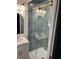 Bathroom featuring new tiles, a glass-enclosed shower, sleek fixtures, and a modern vanity at 3428 Plaza Ln, North Charleston, SC 29420