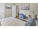 Cozy bedroom with neutral walls, television, desk, and comfortable bed at 3428 Plaza Ln, North Charleston, SC 29420