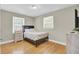 Inviting bedroom with hardwood floors, natural light, and neutral paint at 3428 Plaza Ln, North Charleston, SC 29420
