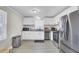 Bright kitchen featuring white cabinets, stainless steel appliances, and granite countertops at 3428 Plaza Ln, North Charleston, SC 29420