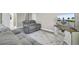 Cozy living room featuring gray sofas, a modern rug, and an entertainment center with a large screen TV at 3428 Plaza Ln, North Charleston, SC 29420