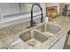Close up of a kitchen sink and faucet with granite countertops at 3428 Plaza Ln, North Charleston, SC 29420