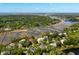Expansive aerial view showcases waterfront property with lush greenery and river access at 3508 Henrietta Hartford Rd, Mount Pleasant, SC 29466