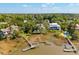 Stunning aerial view of waterfront homes with private docks, pools, and lush greenery, a perfect coastal living at 3508 Henrietta Hartford Rd, Mount Pleasant, SC 29466
