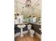 This bathroom features hardwood floors, pedestal sink, toilet and decorative lighting at 3508 Henrietta Hartford Rd, Mount Pleasant, SC 29466