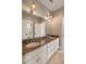 Elegant bathroom featuring a double vanity with granite countertops and a large mirror at 3508 Henrietta Hartford Rd, Mount Pleasant, SC 29466