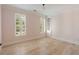 Charming bedroom with pink striped walls, built-in shelving, and bright, shuttered windows at 3508 Henrietta Hartford Rd, Mount Pleasant, SC 29466