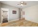Spacious bedroom featuring hardwood floors, a bathroom, and a white shiplap wall at 3508 Henrietta Hartford Rd, Mount Pleasant, SC 29466