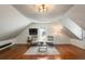 Cozy bonus room featuring hardwood floors, neutral decor, and a comfortable seating area at 3508 Henrietta Hartford Rd, Mount Pleasant, SC 29466