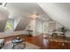 Bright bonus room featuring hardwood floors, shiplap walls, and an office space at 3508 Henrietta Hartford Rd, Mount Pleasant, SC 29466