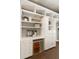 Built-in shelving unit features white cabinets and drawers at 3508 Henrietta Hartford Rd, Mount Pleasant, SC 29466