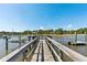 Picturesque wooden dock with boat lift, offering serene waterfront views and convenient boating capabilities at 3508 Henrietta Hartford Rd, Mount Pleasant, SC 29466