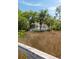 Charming home exterior with a view from the marshland, featuring a screened porch and lush landscaping at 3508 Henrietta Hartford Rd, Mount Pleasant, SC 29466
