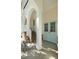 Welcoming home exterior with white columns, brick accents, and elegant doors, showcasing architectural charm at 3508 Henrietta Hartford Rd, Mount Pleasant, SC 29466