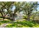 Charming exterior with screened porch overlooking the well manicured lawn at 3508 Henrietta Hartford Rd, Mount Pleasant, SC 29466