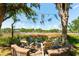 Backyard fire pit and seating area overlooking marshland and river at 3508 Henrietta Hartford Rd, Mount Pleasant, SC 29466