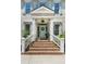 Inviting front entrance featuring a brick staircase, white railings, and classic door with sidelights at 3508 Henrietta Hartford Rd, Mount Pleasant, SC 29466