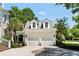 Two-car garage featuring dormer windows and an arched walkway to the main house at 3508 Henrietta Hartford Rd, Mount Pleasant, SC 29466