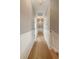 Long hallway with light hardwood floors, detailed wainscoting, and recessed lighting at 3508 Henrietta Hartford Rd, Mount Pleasant, SC 29466