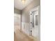 Well-lit hallway showcasing doorways and a glimpse into the home's stylish interiors at 3508 Henrietta Hartford Rd, Mount Pleasant, SC 29466