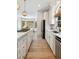 Spacious kitchen with white cabinets, stainless steel appliances, and an island with marble countertops at 3508 Henrietta Hartford Rd, Mount Pleasant, SC 29466