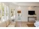 Bright living room with white walls, hardwood floors, and lots of natural light at 3508 Henrietta Hartford Rd, Mount Pleasant, SC 29466