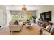 Bright living room with a comfortable sectional sofa, natural light, and stylish decor at 3508 Henrietta Hartford Rd, Mount Pleasant, SC 29466
