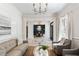 Open-concept living area with views into dining space with fireplace and large windows at 3508 Henrietta Hartford Rd, Mount Pleasant, SC 29466