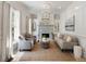 Bright living room with neutral color palette, fireplace, and ample seating at 3508 Henrietta Hartford Rd, Mount Pleasant, SC 29466