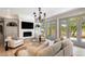 Bright living room features a fireplace, neutral furniture, and serene outdoor views at 3508 Henrietta Hartford Rd, Mount Pleasant, SC 29466