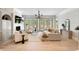 Bright living room with fireplace, neutral furniture, and glass doors to a deck at 3508 Henrietta Hartford Rd, Mount Pleasant, SC 29466