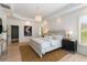 Beautiful main bedroom with wood floors, chandelier and pelican artwork at 3508 Henrietta Hartford Rd, Mount Pleasant, SC 29466