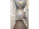 Well-organized mudroom with built-in shelving, bench, and coat hooks at 3508 Henrietta Hartford Rd, Mount Pleasant, SC 29466