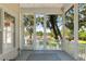 Relaxing screened porch offering tranquil views of the waterway and picturesque landscape at 3508 Henrietta Hartford Rd, Mount Pleasant, SC 29466