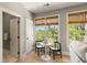 Bright sitting area with bamboo shades, table with chess set, and inviting natural light at 3508 Henrietta Hartford Rd, Mount Pleasant, SC 29466