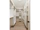 Spacious walk-in closet with custom white shelving and drawers providing organized storage solutions at 3508 Henrietta Hartford Rd, Mount Pleasant, SC 29466