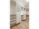 Bright walk-in closet with custom white shelving and drawers offering ample storage space at 3508 Henrietta Hartford Rd, Mount Pleasant, SC 29466
