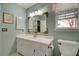 Traditional bathroom with a large framed mirror, vanity, and toilet at 359 Muirfield Pkwy, Charleston, SC 29414