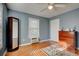 Well-lit bedroom features hardwood floors, a window, and a closet at 359 Muirfield Pkwy, Charleston, SC 29414