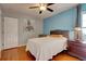 Cozy bedroom with hardwood floors, ceiling fan, and a serene blue accent wall at 359 Muirfield Pkwy, Charleston, SC 29414