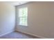 Bedroom with plush carpet, a large window with natural light, and neutral-toned walls at 413 Mistflower Ln, Moncks Corner, SC 29461