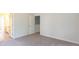 Bedroom with carpet and a door opening into another room at 413 Mistflower Ln, Moncks Corner, SC 29461