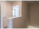 Upstairs landing area leading to a bedroom with an open doorway and natural light at 413 Mistflower Ln, Moncks Corner, SC 29461