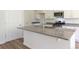 Modern kitchen island featuring granite countertops, stainless steel appliances, and ample cabinet space at 413 Mistflower Ln, Moncks Corner, SC 29461