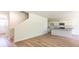 Spacious living room with wood flooring, abundant natural light, and seamless access to the kitchen at 413 Mistflower Ln, Moncks Corner, SC 29461